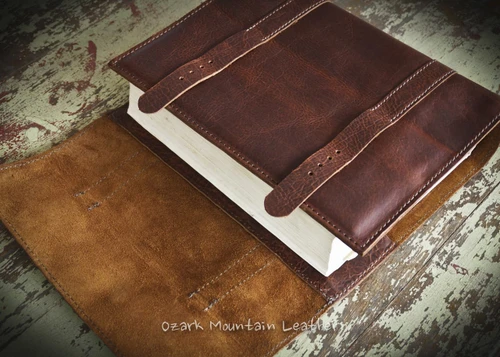Handmade brown bison leather Bible cover with double straps and buckle closure, featuring natural grain texture and rustic full-grain finish. Custom Bible Cover
