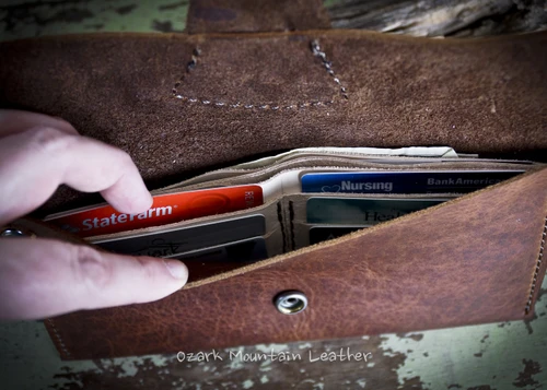 Bison leather clutch or wrist wallet.  Great travel wallet for hands free shopping.