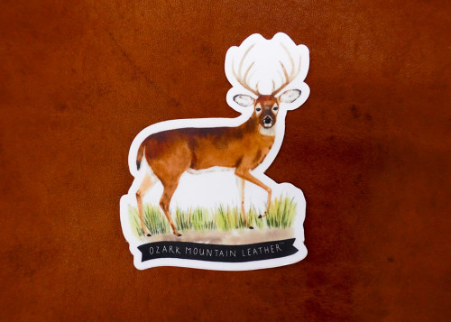 Whitetail deer hunting sticker with buck standing in grass by Ozark Mountain Leather, durable vinyl outdoor decal