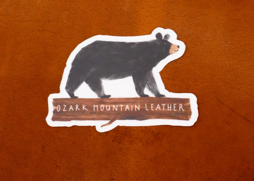 Black bear hunting sticker walking on log by Ozark Mountain Leather, durable vinyl wildlife outdoor decal