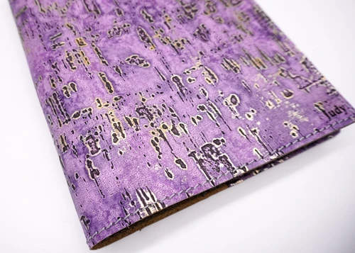 Close-up of purple birch embossed leather wood-grain texture