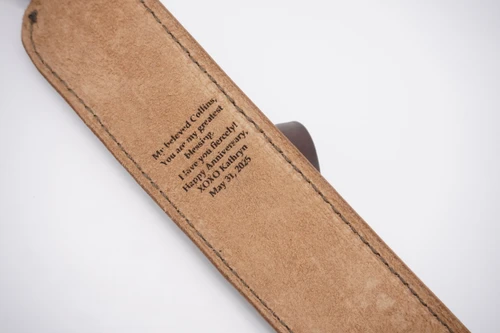 Laser engraved leather rifle sling.