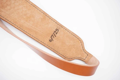 Handmade rifle sling with custom laser engraving on Hermann Oak leather by Ozark Mountain Leather.