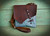 Bison and Turquoise Cross Body Leather Bag with skeleton key closure.