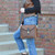 Conceal and carry bag in distressed bag made by Lady Conceal.  Full grain leather with a western laced detail.