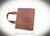 Custom leather Bible cover or leather book cover made from Bison leather with name or initials personalized and customized to your book size.  Made by Ozark Mountain Leather.  American bison or buffalo leather tanned here in the USA.  Carry handle Bible cover