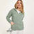 B940 373 Seafoam Green Ladies Buttoned Cabled Cardigan Lifestyle Front View ExclusivelyIrish.com B940 373 Seafoam Green Ladies Buttoned Cabled Cardigan Lifestyle Front View ExclusivelyIrish.com