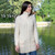 ML114 100 Natural White Soft Touch Ladies Aran Zip Cardigan Lifestyle Front View ExclusivelyIrish.com