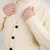 MM201 100 NATURAL WHITE Colour Men’s Merino Aran Button Cardigan Closeup View ShopAran.com
