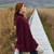 ML165 108 WINE RED Colour Wool Aran Knit Poncho Funnel Neck Side View ShopAran.com