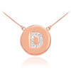 Letter "D" disc necklace with diamonds in 14k rose gold.