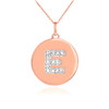 Letter "E" disc pendant necklace with diamonds in 14k rose gold.