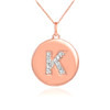 Letter "K" disc pendant necklace with diamonds in 14k rose gold.