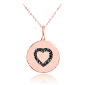 Heart disc pendant necklace with black diamonds in 14k rose gold.