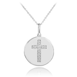 Cross disc pendant necklace with diamonds in 14k white gold.