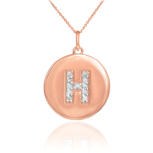 Letter "H" disc pendant necklace with diamonds in 14k rose gold.