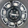 Set Of Four New Takeoff Ford F250 Black And Machine Wheels With 275/65R20 Bridgestone A/T Tires