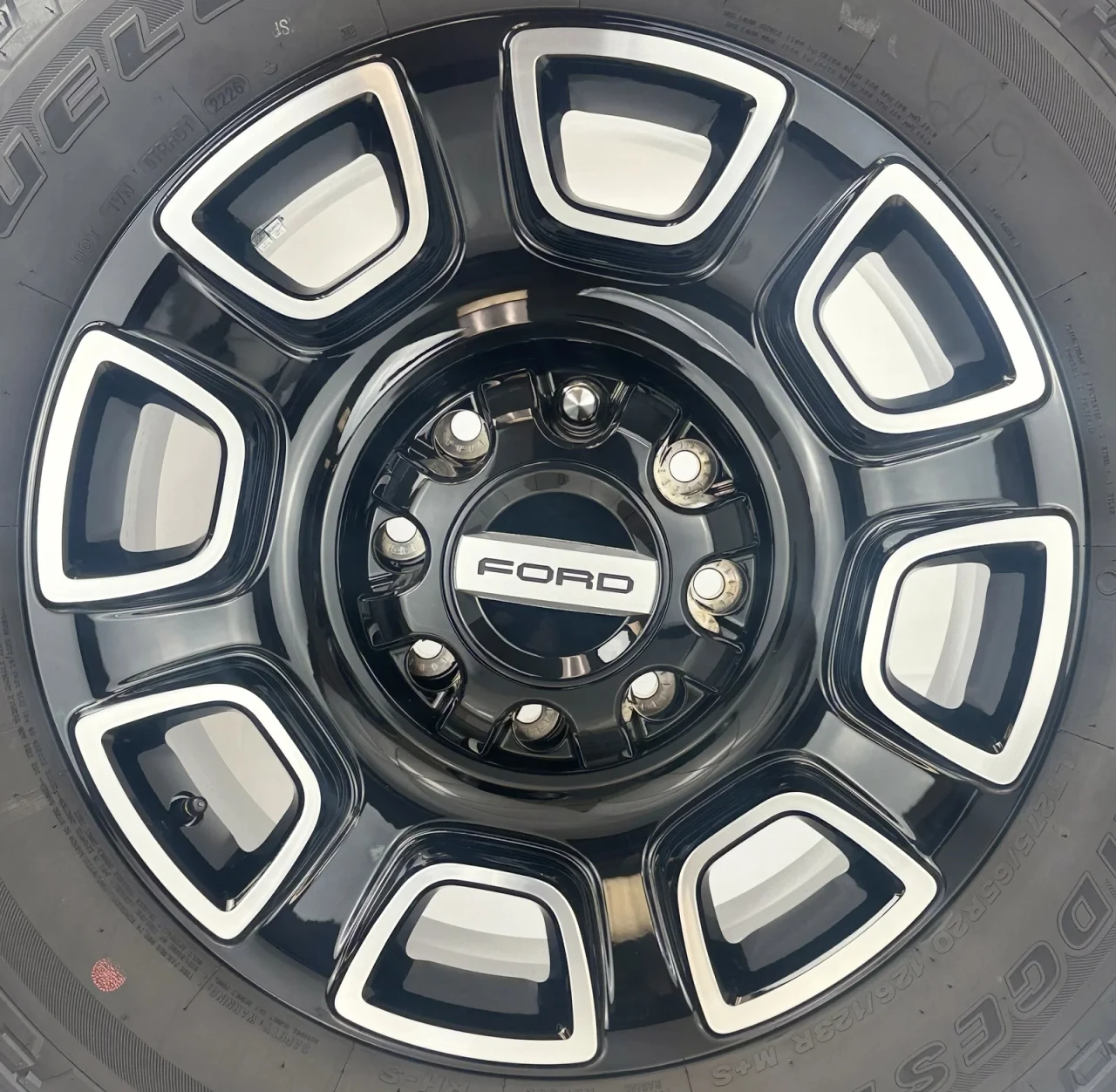 Set Of Four New Takeoff Ford F250 Black And Machine Wheels With 275/65R20 Bridgestone A/T Tires