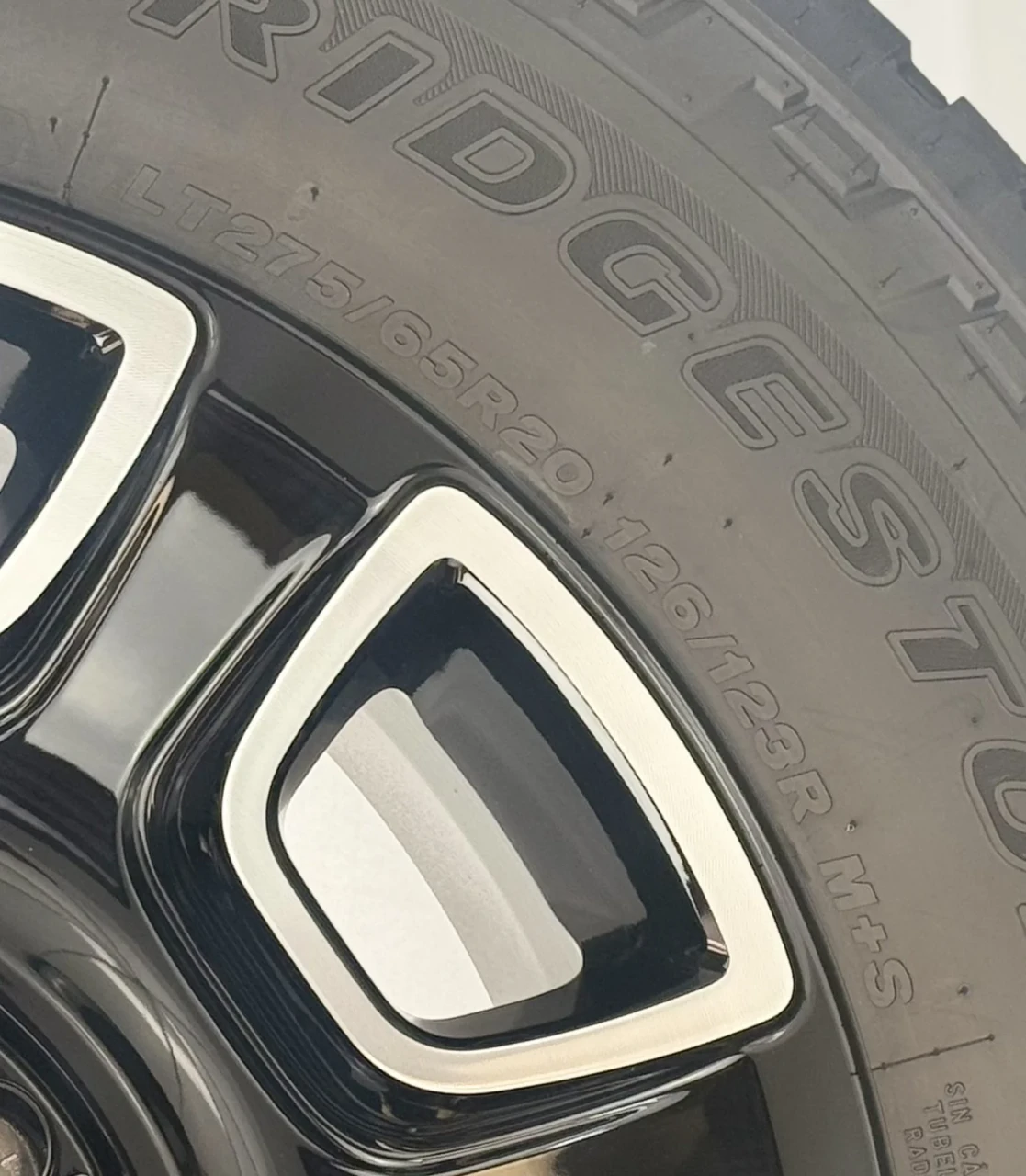 Set Of Four New Takeoff Ford F250 Black And Machine Wheels With 275/65R20 Bridgestone A/T Tires
