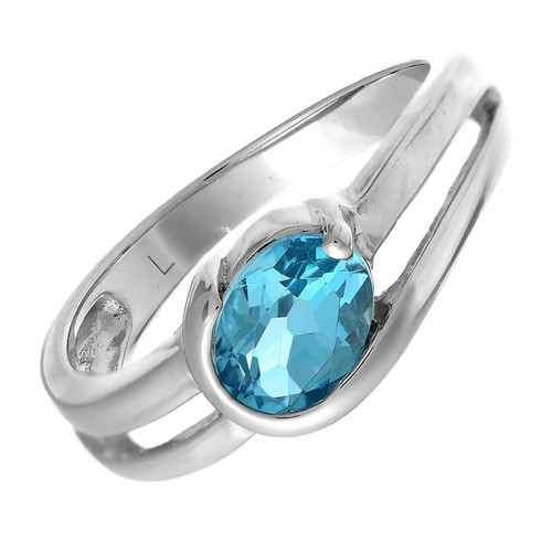 Sterling Silver ring for women set with a large oval blue topaz  - gemstone jewellery. Available in a wide range of sizes and presented in a luxury jewellery ring box.