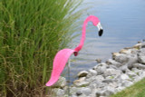 Flamingos dancing garden art that moves with the wind atop 35" stakes, made in Michigan, USA.