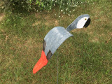 Royal African Grey Parrot dancing garden art that moves with the wind atop a 35" stake, made in Michigan, USA.