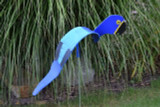 Blue Macaw dancing garden art that moves with the wind atop a 35" stake, made in Michigan, USA.