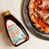Roquito Hot Honey drizzled on a pizza