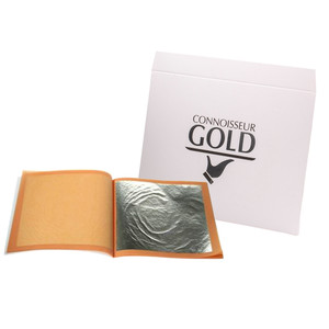 Connoisseur Gold Edible Silver Leaf pack with five thin silver sheets shown inside an open booklet next to branded white packaging. Connoisseur Gold Edible Silver Leaf pack with five thin silver sheets shown inside an open booklet next to branded white packaging.