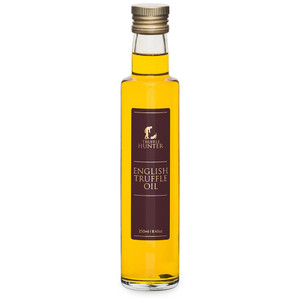 Bottle of Truffle Hunter English Truffle Oil 250ml with gold screw cap and brown label featuring product name and brand logo. Bottle of Truffle Hunter English Truffle Oil 250ml with gold screw cap and brown label featuring product name and brand logo.