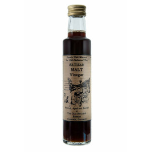 A 250ml glass bottle of Artisan Malt Vinegar with a gold screw cap and a vintage-style brown label reading "Artisan Malt Vinegar – Brewed, Aged and Bottled at The Old Nuclear Bunker, Coverack, Cornwall." The label also shows traditional oak barrels and a hand-drawn illustration, emphasising the product's small-batch and traditional oak-aged production. A 250ml glass bottle of Artisan Malt Vinegar with a gold screw cap and a vintage-style brown label reading "Artisan Malt Vinegar – Brewed, Aged and Bottled at The Old Nuclear Bunker, Coverack, Cornwall." The label also shows traditional oak barrels and a hand-drawn illustration, emphasising the product's small-batch and traditional oak-aged production.