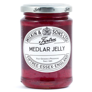 Tiptree Medlar Jelly 340g jar – traditional British fruit preserve in a clear glass jar with white label and metal lid. Tiptree Medlar Jelly 340g jar – traditional British fruit preserve in a clear glass jar with white label and metal lid.