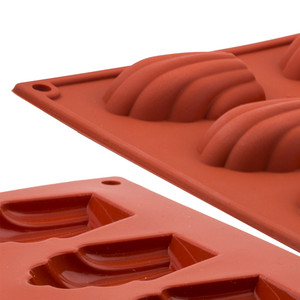 Silikomart Madeleine Professional Silicone Mould. Non-stick, freezer-to-oven safe mould for perfect madeleine sponges. Professional-grade and dishwasher safe. Silikomart Madeleine Professional Silicone Mould. Non-stick, freezer-to-oven safe mould for perfect madeleine sponges. Professional-grade and dishwasher safe.