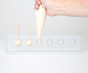 6 Cavity Lollipop Mould. Professional non-stick tray for round chocolate or sugar lollipops. Six cavities for consistent, easy release results. 6 Cavity Lollipop Mould. Professional non-stick tray for round chocolate or sugar lollipops. Six cavities for consistent, easy release results.