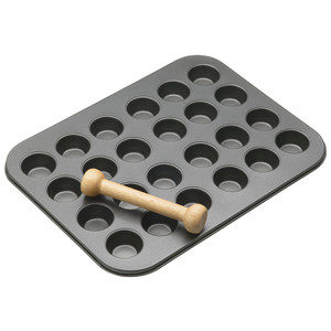 MasterClass Non Stick 24 Hole Mini Tin with wooden pastry press. Ideal for baking mini tarts, quiches and pastries with easy release and even cooking. MasterClass Non Stick 24 Hole Mini Tin with wooden pastry press. Ideal for baking mini tarts, quiches and pastries with easy release and even cooking.