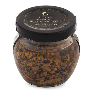 Truffle Hunter Minced Black Truffle 80g finely chopped black truffle for sauces, pasta and eggs. Rich, earthy flavour and easy to use.