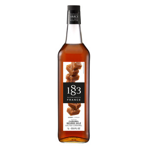 Bottle of 1883 Maison Routin Salted Caramel Syrup 1L, featuring rich amber liquid and a label with images of soft caramel pieces. Bottle of 1883 Maison Routin Salted Caramel Syrup 1L, featuring rich amber liquid and a label with images of soft caramel pieces.