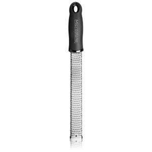 Microplane Premium Classic Series Zester with ultra-sharp stainless steel blade for citrus, cheese, chocolate, and spices. Dishwasher safe. Microplane Premium Classic Series Zester with ultra-sharp stainless steel blade for citrus, cheese, chocolate, and spices. Dishwasher safe.