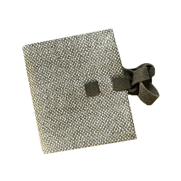 Buy the Mini Linen Notebook. A pocket-sized notebook with a natural linen cover, plain pages and wraparound strap, perfect for notes, recipes and ideas.
