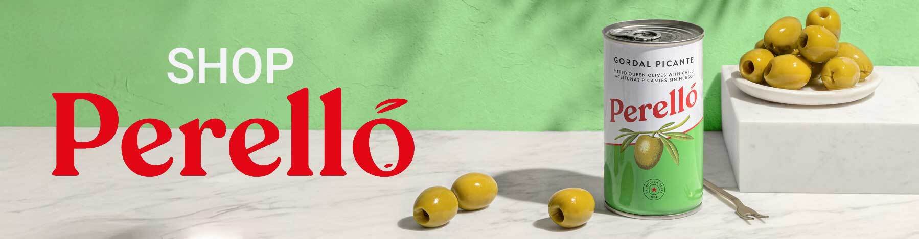 Perello Gordal Picante olives in tin with green olives on marble surface promoting Perello olives and Mediterranean ingredients online