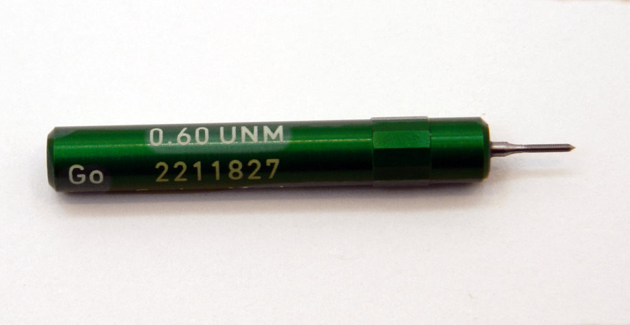 0.60UNM Plug Go Gage pitch .15mm; UNM stands for United National Miniature the American Metric miniature Thread standard. Precision Thread Gage made of High Speed Steel then hardened. Picture is representative of part,  We have two pieces in stock.  Brand is;" MiniTaps" made specifically for us in Switzerland