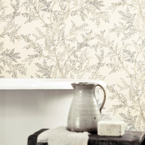 Entwined birch tree branches trail upwards on this whimsical wallpaper design which was inspired by a painted sampler discovered in the archive. Branches shimmer with metallic highlights and tonal watercolour layers add to the designs enchanting feel. Available in neutral colourways and ideal for spaces in need of light.