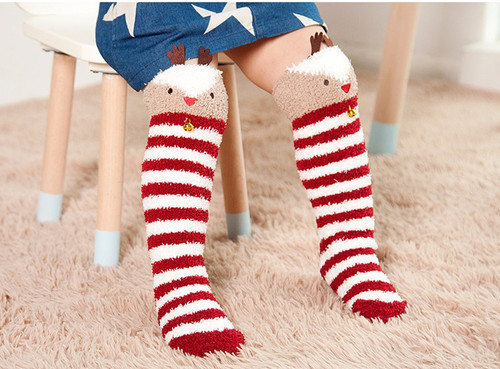 Oh Deer - Soft and fuzzy Reindeer Knee-High Socks/Leggings for your Baby, Infant, or Toddler.  

The knee high leg warmer socks are made of cotton in the colors of brown and red and white striped, with an anti-slip sole and adorned with brown felt antlers and jingle bell.  They are sized to fit babies ages 1-3 yrs old.

Perfect for a First Christmas, Rudolph The Red-Nosed Reindeer Theme party, Birthday, Holidays, Wintertime or keeping your little one cozy.

AVAILABLE TO SHIP IMMEDIATELY!!