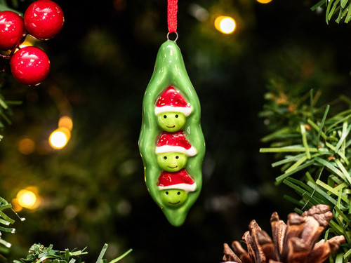 Peas in a pod with Santa hats on a Christmas tree