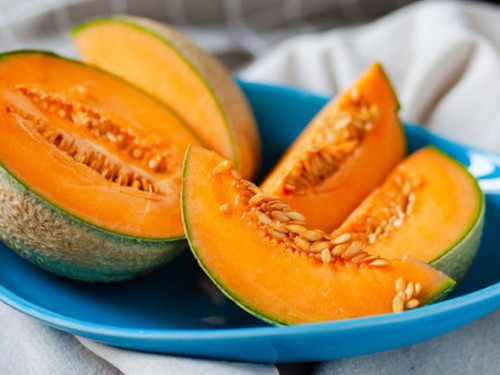 Melon (Robinson variety) shown whole or sliced, ripe fruit ready to eat