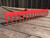 red 16 tooth steel rake