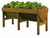 Spring vegetable plants in a vegtrug natural timber colour raised planter