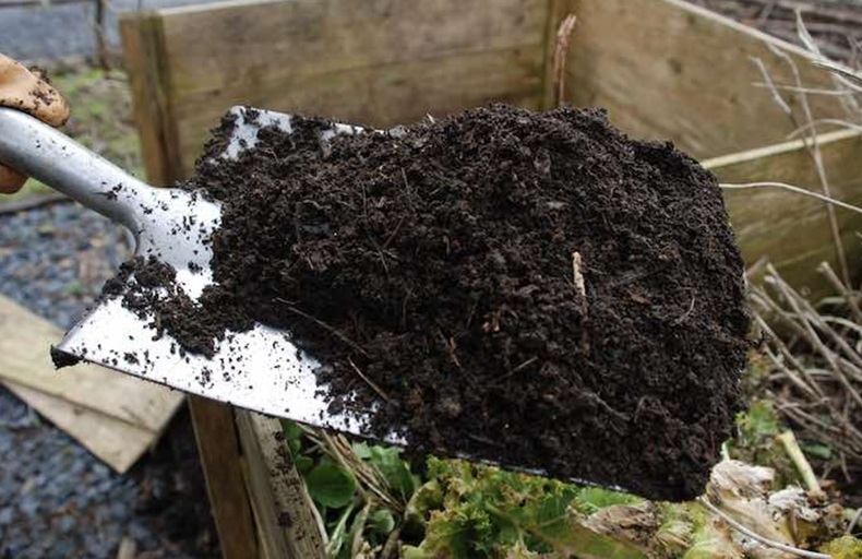 shovelling compost
