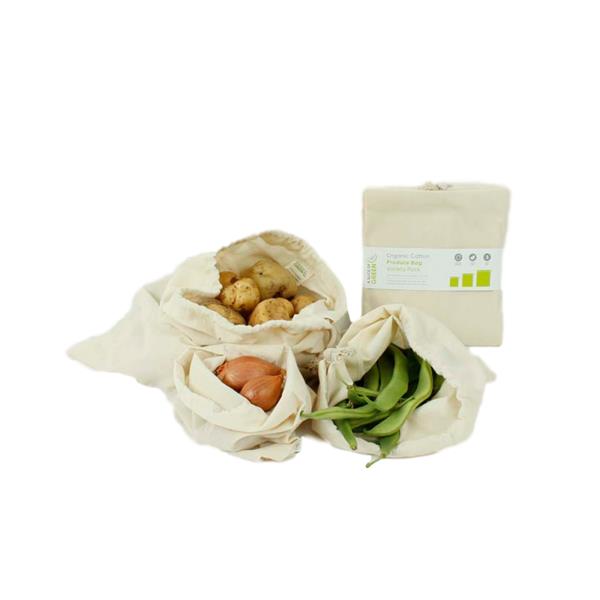 3 cotton bags filled with food on white background