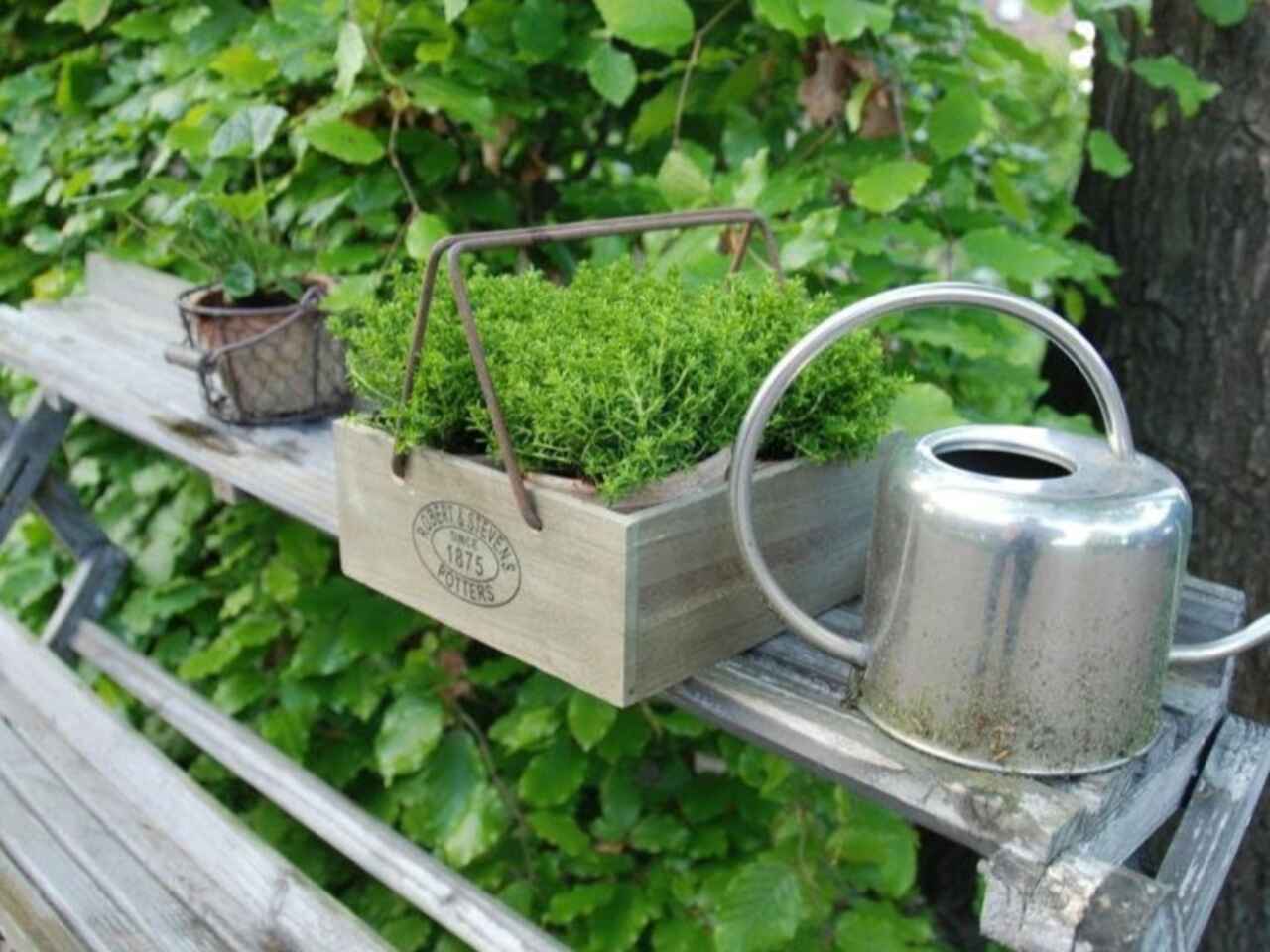 Pots in crate on a bench